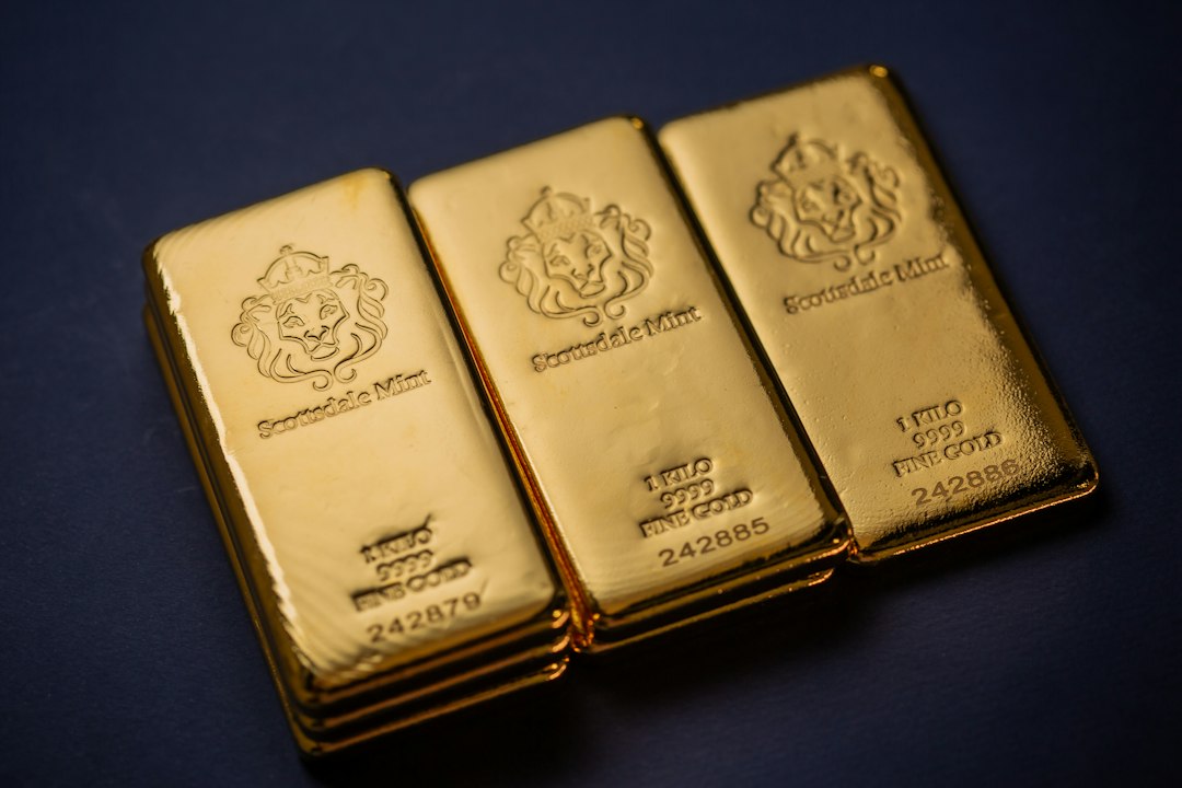 Three gold bars sitting next to each other on a table