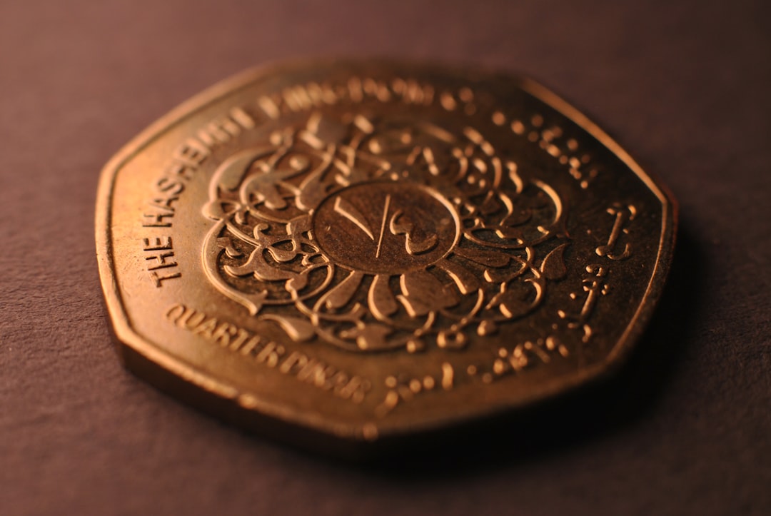 A close up of a gold coin on a table