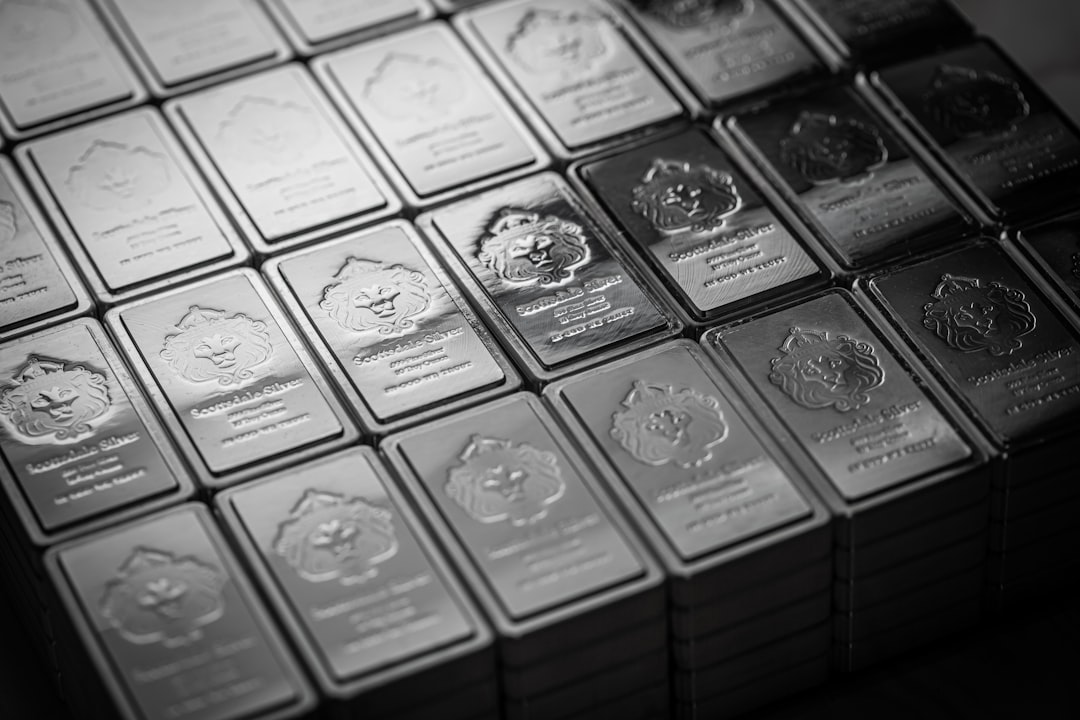 A pile of silver bars sitting on top of a table