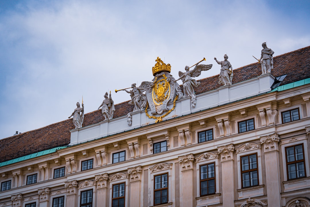 A large building with statues on top of it