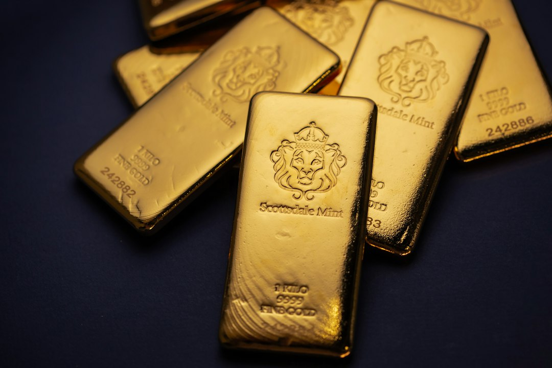 A pile of gold bars sitting on top of a table