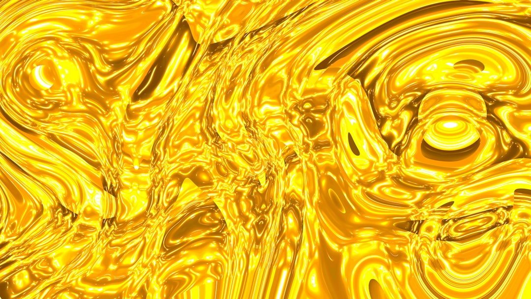 Abstract swirling golden liquid texture.