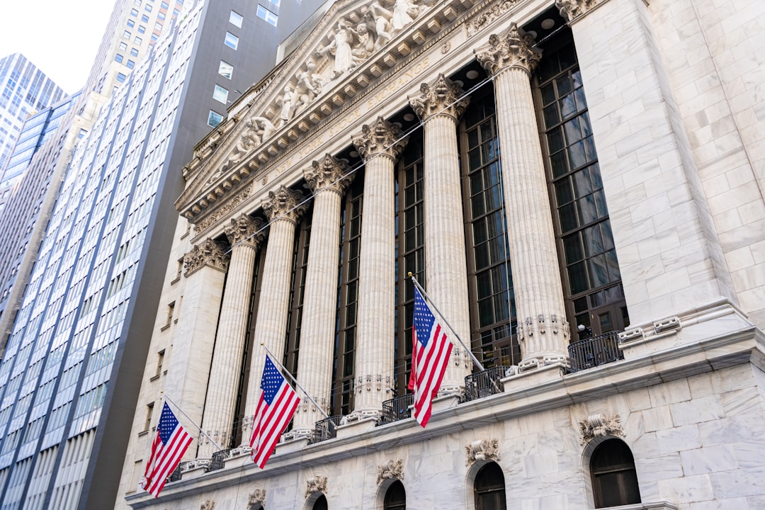 New york stock exchange building with american flags.