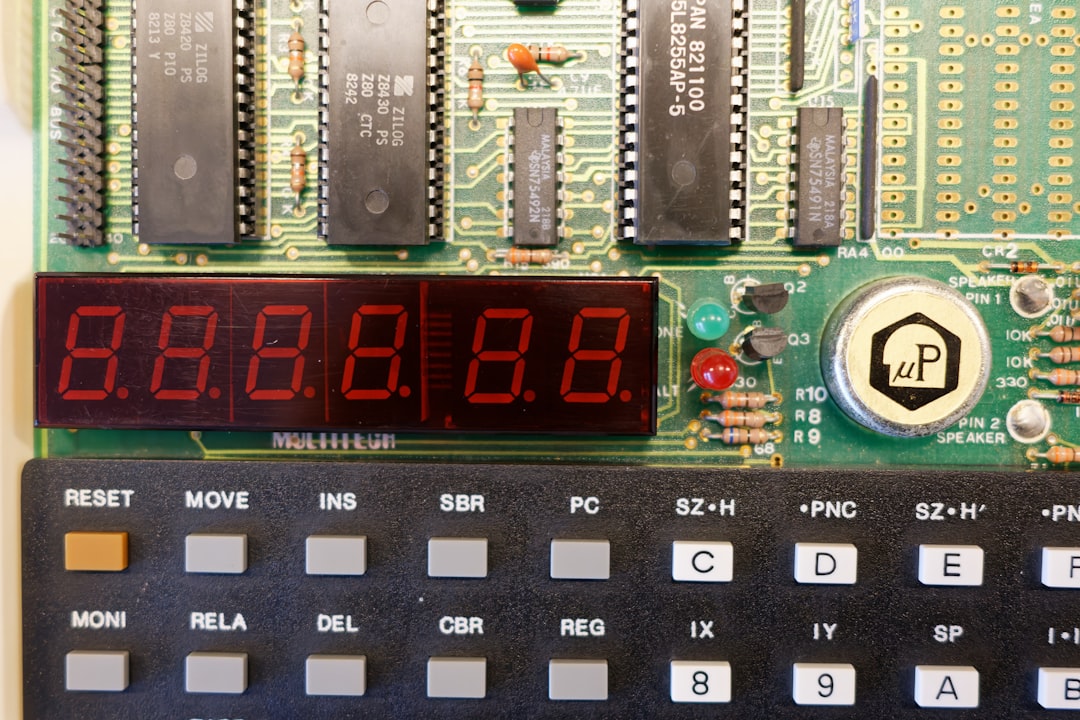 a digital clock sitting on top of a electronic board