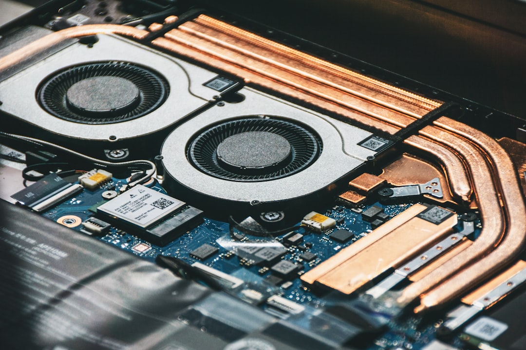 Close-up of computer cooling fans and heat pipes.