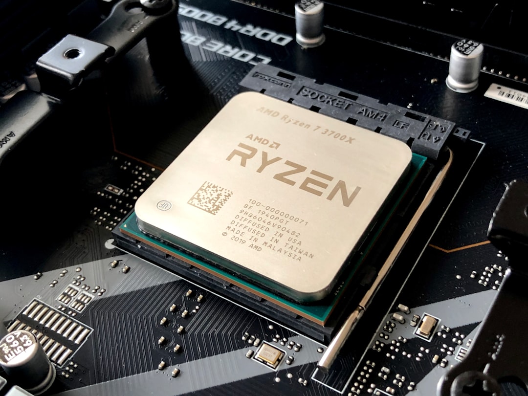 A computer processor installed in a motherboard socket with visible text and circuitry