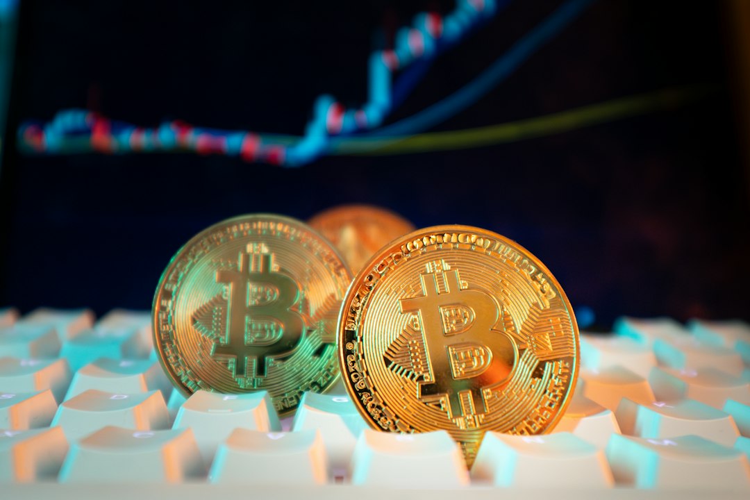 Bitcoin coins are displayed with a stock chart
