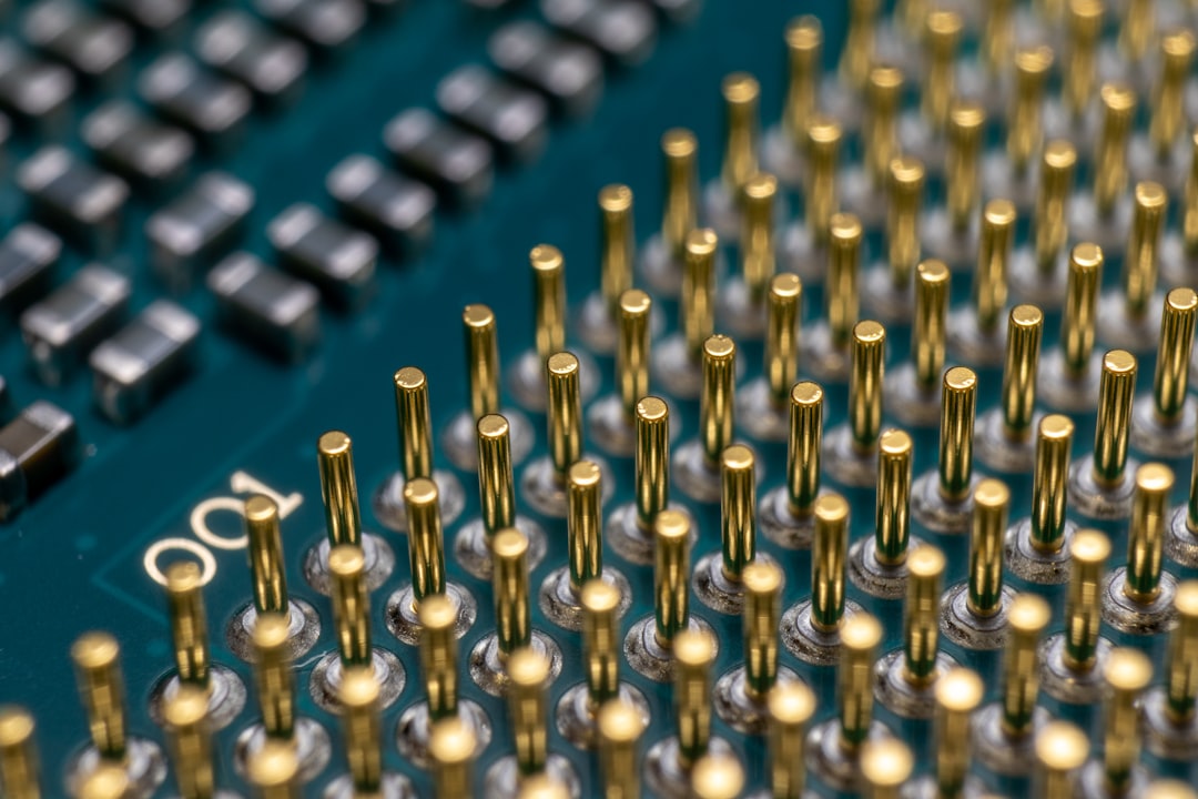 a close up of a computer board with many screws