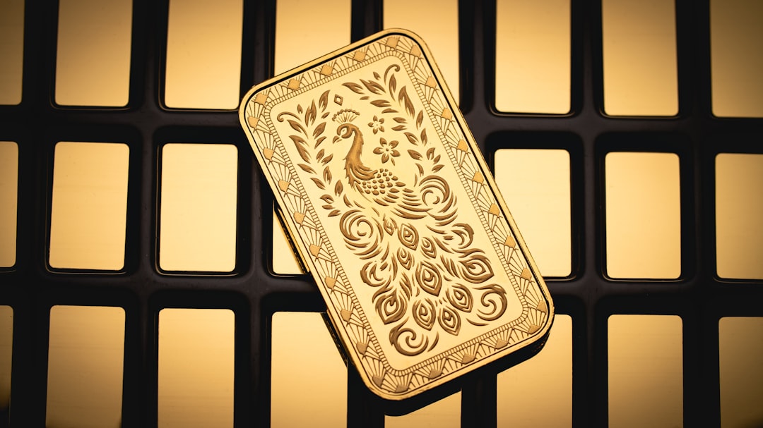 A gold plate with a peacock on it